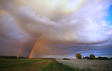 Late evening rain cloud with rainbow