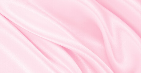Smooth elegant pink silk or satin texture as wedding background. Luxurious background design