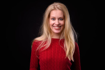 Portrait of happy beautiful woman with blond hair ready for winter