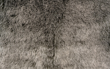 Graues weiches und flauschiges Schaffell als Hintergrund