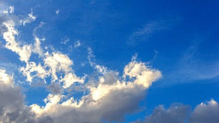 White clouds cumulus floating on blue sky for backgrounds concept