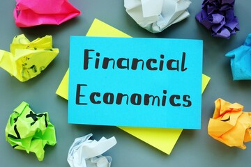 Financial concept meaning Financial Economics with inscription on the piece of paper.