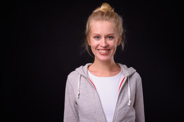 Portrait of happy beautiful woman with blond hair ready for gym