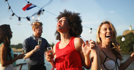 Fototapeta premium Happy group of friends having party and fun together