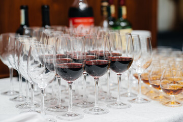 Festive glasses on the festive table during the Banquet. Alcoholic beverage