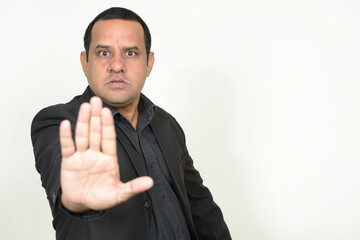 Portrait of overweight Indian businessman in suit