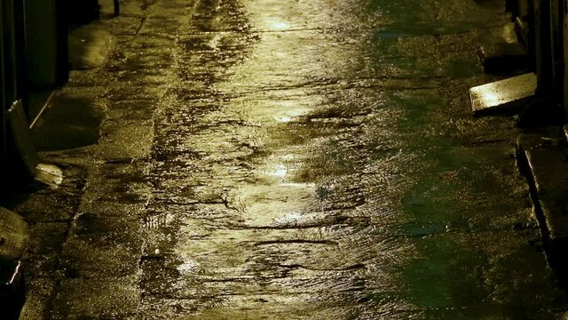 A rainy evening in a narrow, dark alley