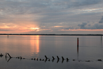 Long exposure golden sunset over Breydon Water, a stretch of the River Yare at Great Yarmouth, Norfolk, UK