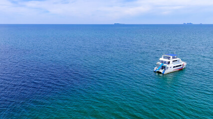 Fototapeta na wymiar Aerial view of speed boat over the beautiful blue sea