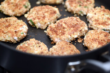 Fish cake cooking in a fry pan