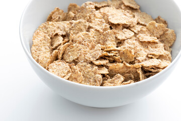 Bowl of whole grain muesli isolated on the white background.