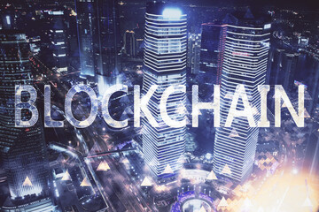 Multi exposure of cryptocurrency theme hologram drawing and city veiw background. Concept of...