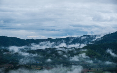 Landscape image of foggy greenery rainforest mountains and hills