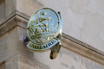 Notaire golden logo and sign on notary french wall building office