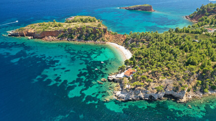 Fototapeta na wymiar Aerial drone panoramic photo of paradise beaches in Kokinokastro with crystal clear turquoise sea, Alonissos island, Sporades, Greece 