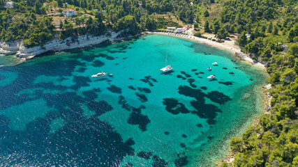 Fototapeta na wymiar Aerial drone panoramic photo of secluded paradise beach and bay of Spartines with crystal clear turquoise sea, Alonissos island, Sporades, Greece 