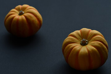 Fresh orange pumpkins isolated on black background.