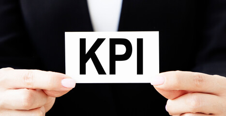 businessman showing business card with word KPI