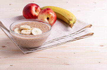 a portion of morning granola porridge served on rustic wooden surface