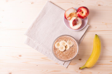 a portion of morning granola porridge served on rustic wooden surface