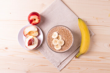 a portion of morning granola porridge served on rustic wooden surface