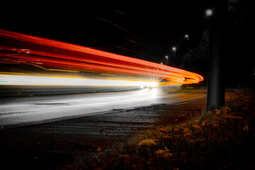 Colored motion stripes produced by the lights of passing cars in the night