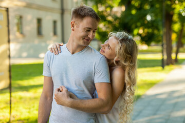 Fototapeta premium Portrait of beautiful young loving couple smiling outdoors