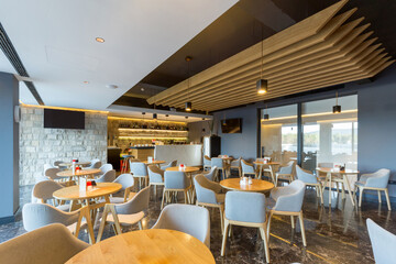 Fototapeta na wymiar Interior of a empty modern hotel cafe bar
