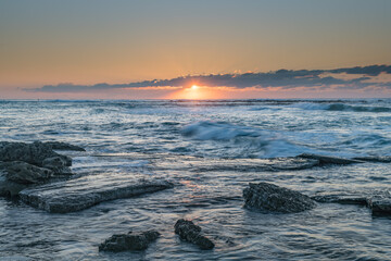 Sunrise Seascape with a low cloud bank