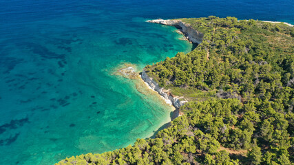 Aerial drone panoramic photo of secluded paradise beach and bay of Spartines with crystal clear turquoise sea, Alonissos island, Sporades, Greece 