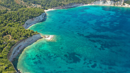 Aerial drone panoramic photo of secluded paradise beach and bay of Spartines with crystal clear turquoise sea, Alonissos island, Sporades, Greece 