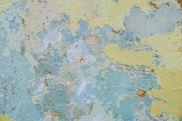 Old dirty painted wall. Several layers of peeling paint. rusty blur. background texture. Horizontal