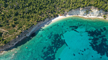 Fototapeta premium Aerial photo taken by drone of Caribbean tropical exotic island lagoon with turquoise clear sea sandy beaches and rare pine trees