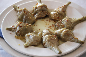 Artichoke dish. Cooked with sauce and garlic