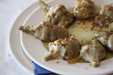 Artichoke dish. Cooked with sauce and garlic
