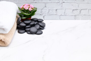 Beautiful composition with spa stones on grey marble table
