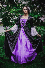 Fototapeta premium Lady in black and purple baroque dress