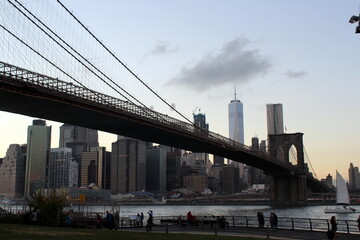 Panorama view of the Manhattan skyline and the Brooklyn Bridge at dusk, evening - Hudson River - New York 