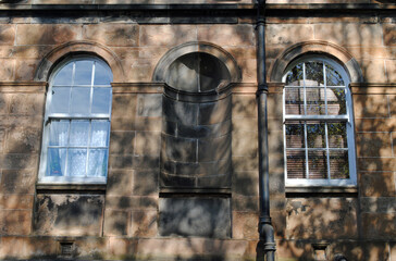 Arched Windows & Niche in Stone Wall of Old Building 