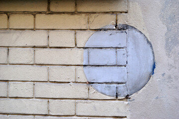 Brick & Concrete Wall with Circular Ghost Image of Old Sign 