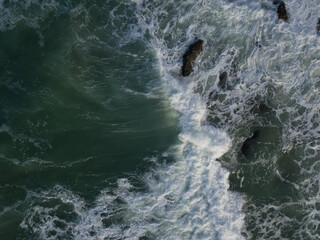 Aerial photo of a small surf break off the coast of New Zealand. 