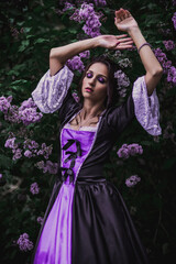 Fototapeta premium Lady in black and purple baroque dress