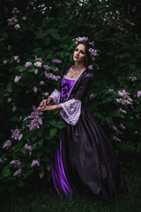 Fototapeta premium Lady in black and purple baroque dress