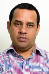 Fototapeta premium Portrait of overweight Indian businessman against white background