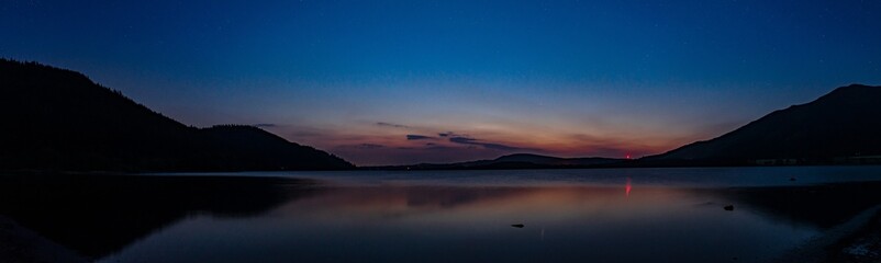 Fototapeta na wymiar A Panoramic view of Bassenthwaite lake in the blue hour on a summers night.