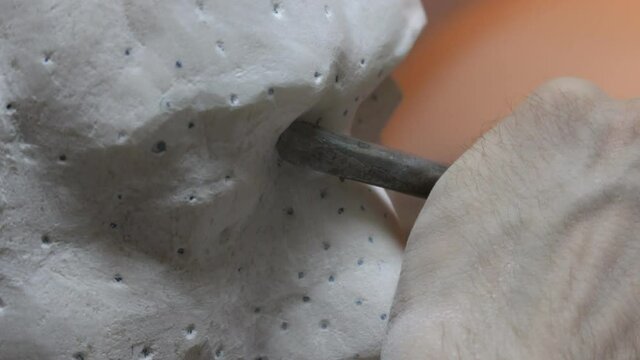 Sculptor Carving On Marble. Working with stone and sculpting statue