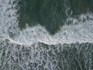 Aerial photo of a small surf break off the coast of New Zealand. 