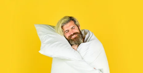 Fotobehang Fall asleep on go. Man handsome guy with pillow and duvet. Enough amount sleep. Tips sleeping better. Bearded man sleeping face relaxing. Melatonin makes you feel drowsy and helps you stay asleep © be free