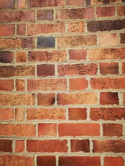 Obraz premium Red brick wall in a vertical format - background