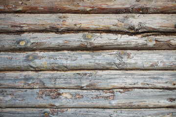 Old wooden blockhouse. Close-up. Horizontal view. Background. Texture.
